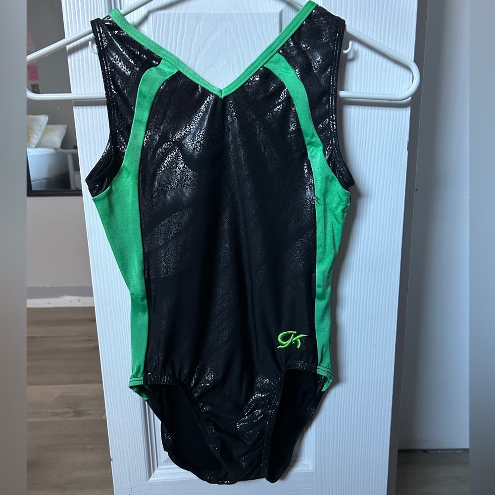 Green and black GK gymnastics leotard.